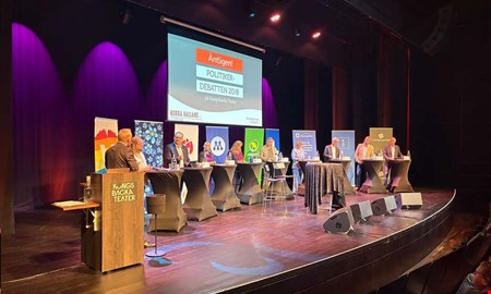 Politisk debatt tre veckor före valet